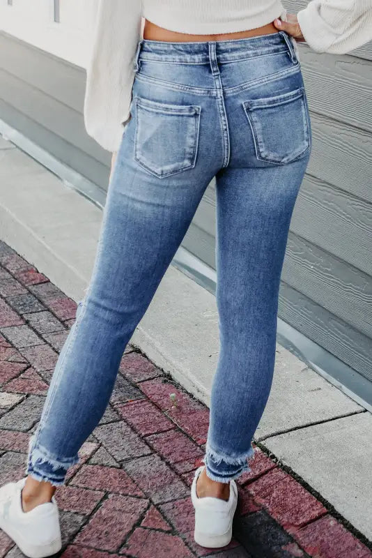 Light blue distressed frayed ankle skinny jeans