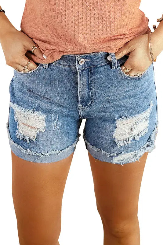 Distressed ripped denim shorts with frayed details - relax in style with our rolled hem design