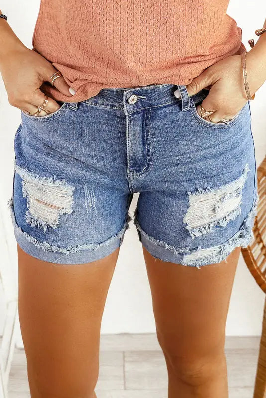 Distressed ripped denim shorts with rolled hem - perfect for a relaxed, trendy look