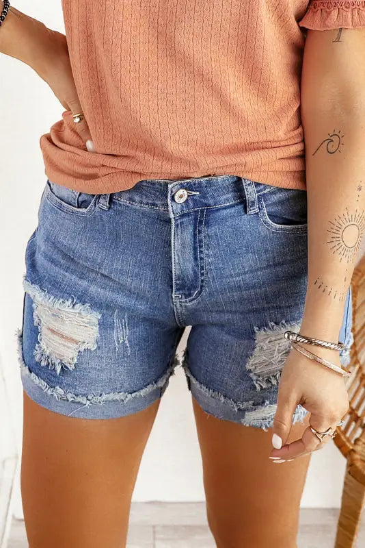 Distressed ripped denim shorts with ripped details and frayed edges - relax in style