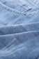 Close-up of distressed ripped denim fabric from distressed ripped denim shorts - rolled hem