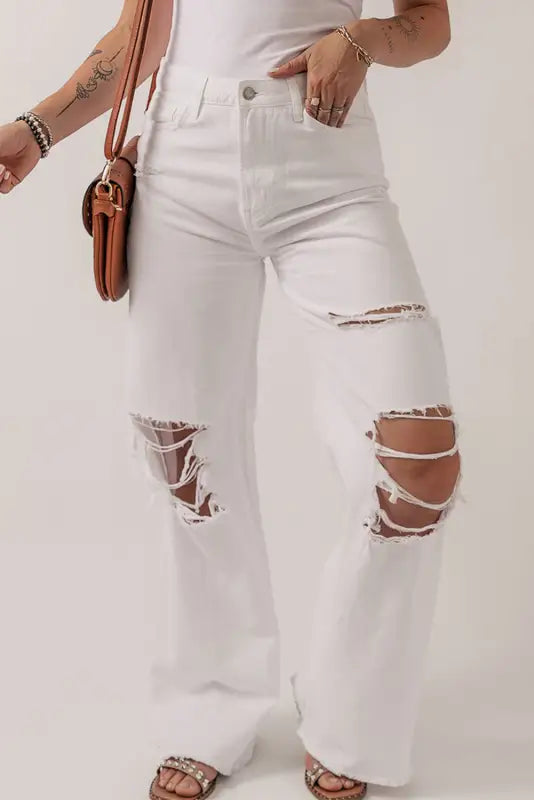 Bright white heavy distressed straight leg jeans