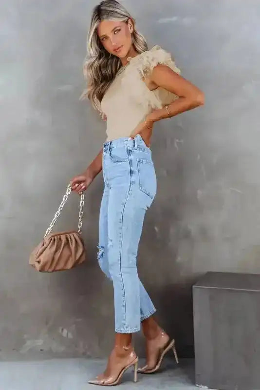 Side view of Dotty Mesh Ruffle Sleeve Ribbed Knit Top showing dotty mesh ruffle detail and ribbed body — Fashionfitz