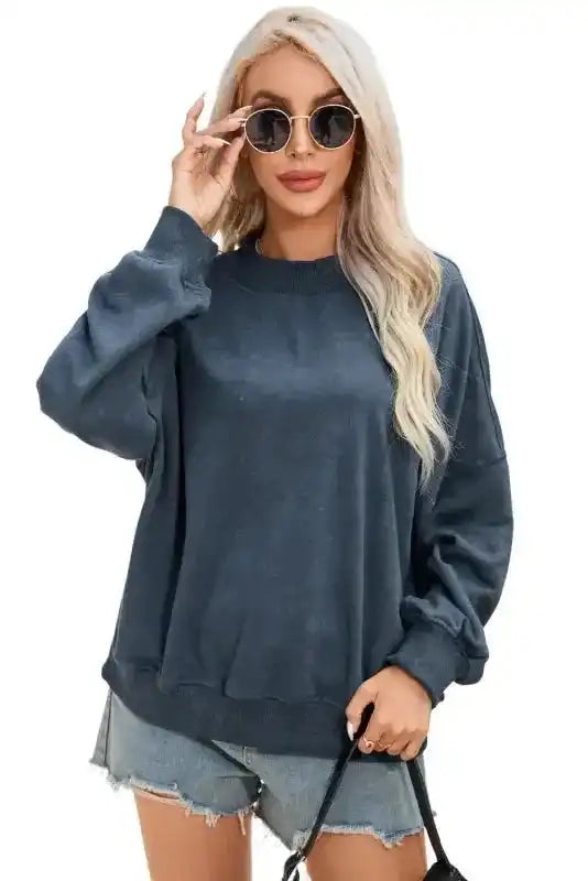 Model wearing Cozy Drop Shoulder Crew Neck Sweatshirt in navy with denim shorts, styled for a casual and trendy daily outfit.