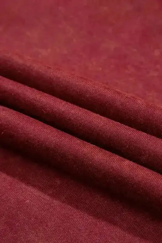 Folded view of red Drop Shoulder Crew Neck Sweatshirt fabric, highlighting its thick and cozy winter texture.