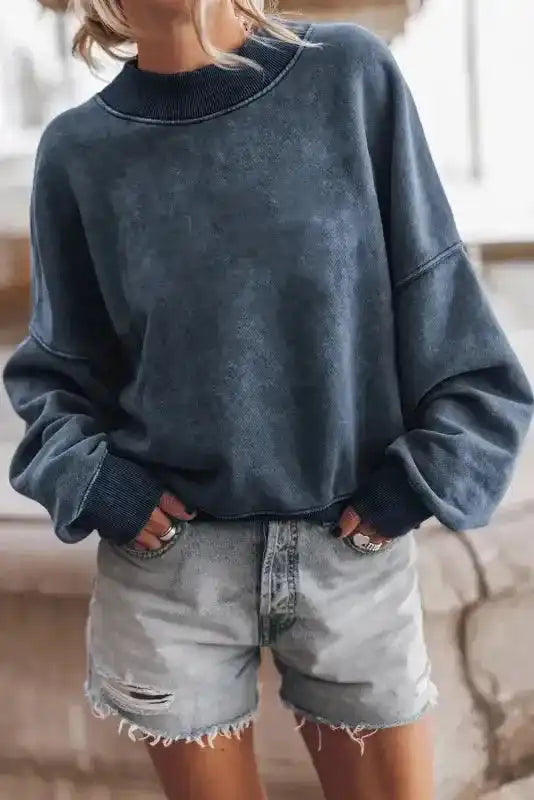 Craft washed Drop Shoulder Crew Neck Sweatshirt styled with distressed shorts, offering a cozy and trendy vibe.