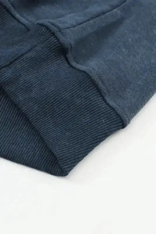 Close-up of ribbed cuff on Cozy Drop Shoulder Crew Neck Sweatshirt in washed navy, highlighting soft knit texture and casual style.