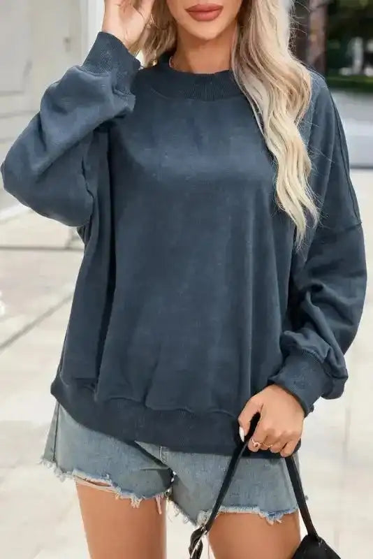 Charcoal Drop Shoulder Crew Neck Sweatshirt styled with denim shorts and handbag, perfect for casual winter outings.