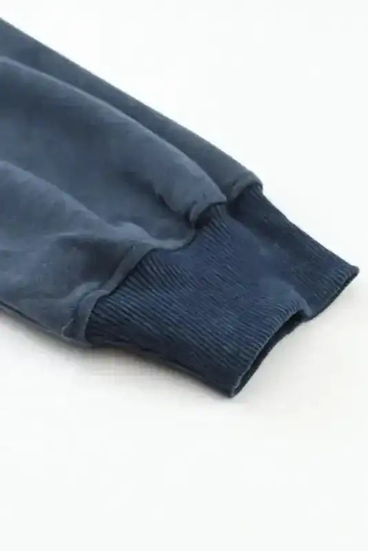 Detailed view of ribbed sleeve cuff on Drop Shoulder Crew Neck Sweatshirt, designed for comfort and warmth.