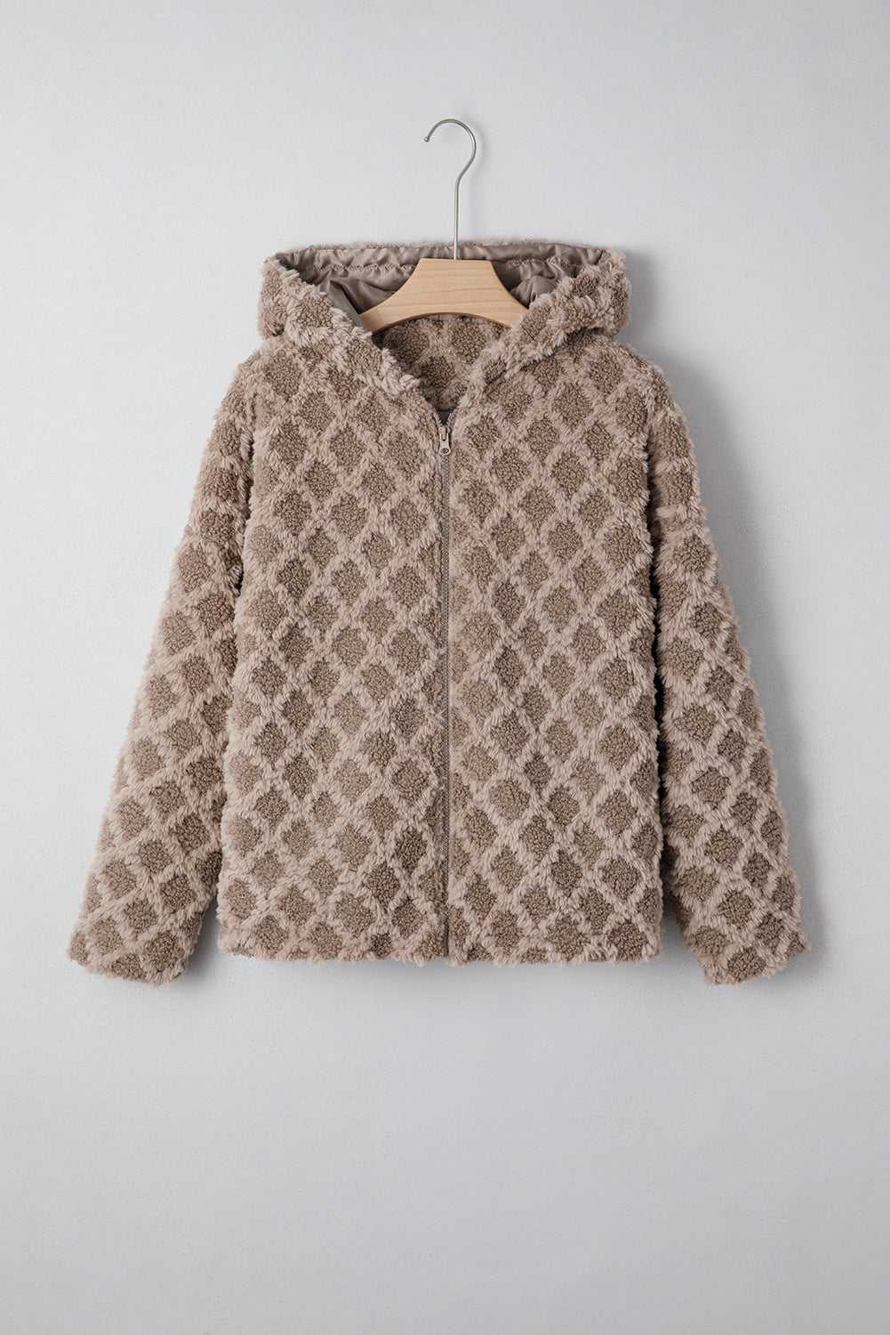 Front view of Camel Sherpa Fleece Jacket on hanger, featuring quilted hood and zip-up design, ideal for cozy and stylish winter layering.