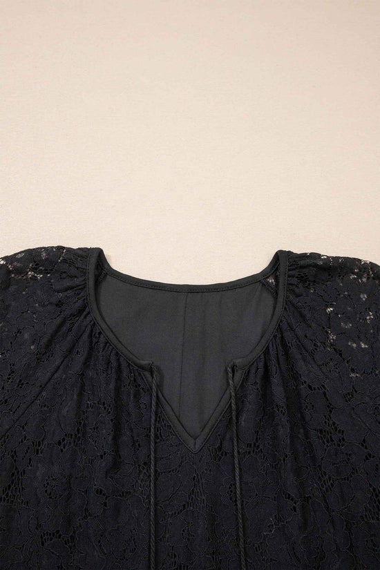 Close-up of the neckline on the Black Lace Maxi Dress with tassel ties and soft inner lining, highlighting its Southern Belle summer style.