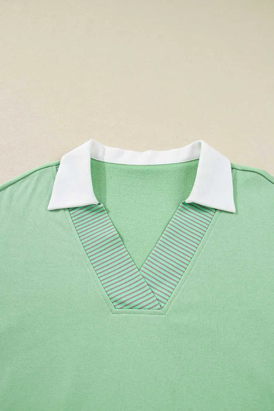 Detail shot of Curve Jade Stripe V‑Neck Sweatshirt for Women focusing on striped V-neck and white collar design.