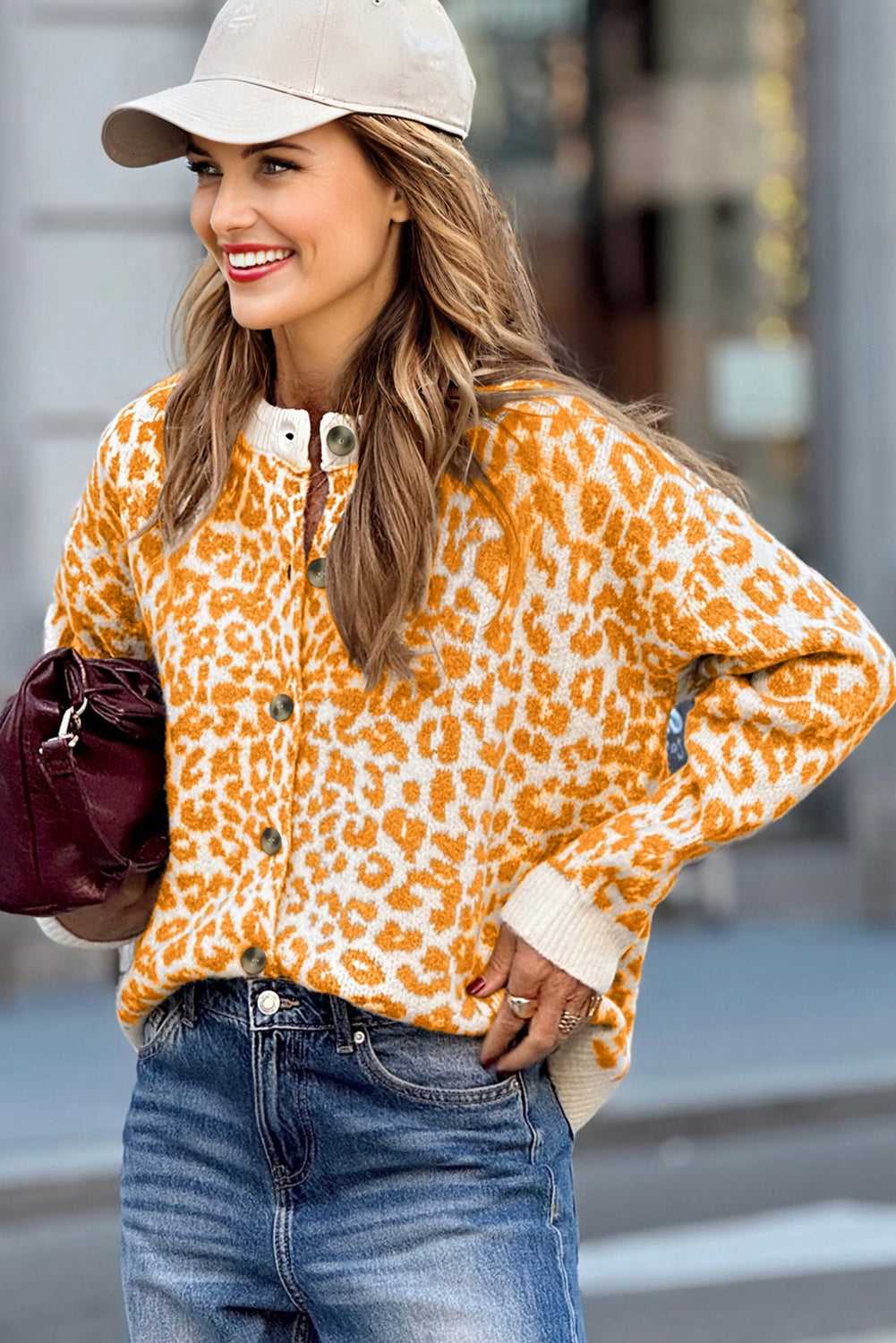 Button-up knit cardigan in orange leopard pattern