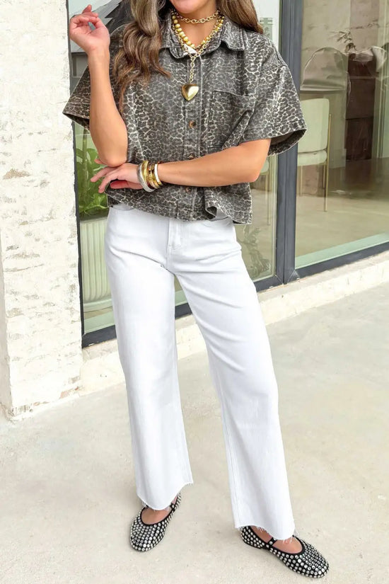 Full outfit featuring gray leopard short sleeve denim shirt paired with white pants and black studded flats for a casual western look.