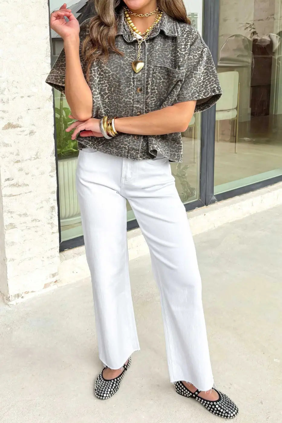 Full outfit featuring gray leopard short sleeve denim shirt paired with white pants and black studded flats for a casual western look.