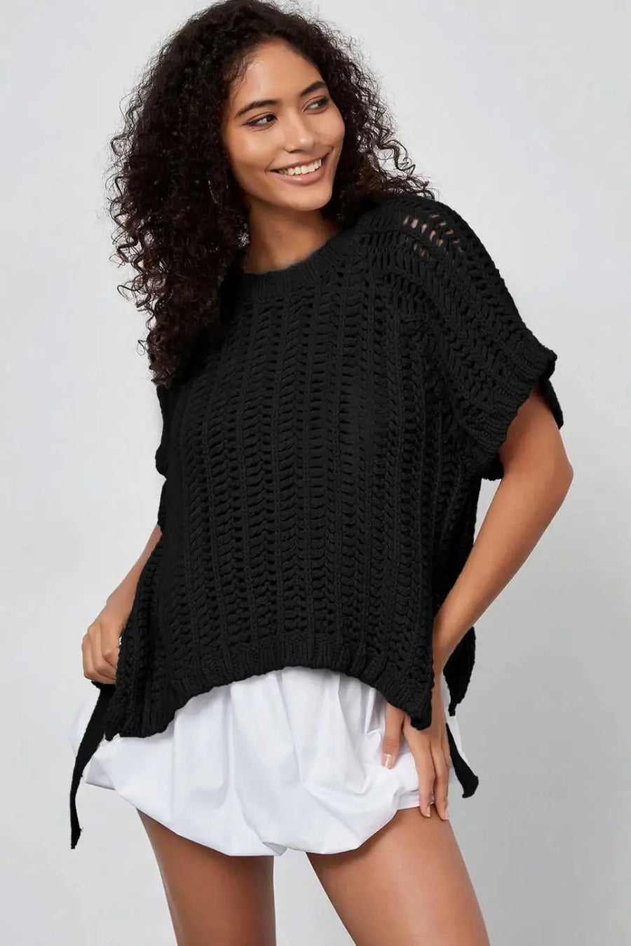 Front angled view of black Plus Size Bow Tie Open‑Knit Jumper for Women featuring soft open-knit design and feminine bow tie.