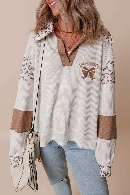 Embroidered Leopard Polo – Chic white long sleeve top with leopard print accents, bow detail, and 'gameday' text, ideal for fall casual wear.