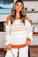 Woman wearing a patterned sweater in a kitchen setting