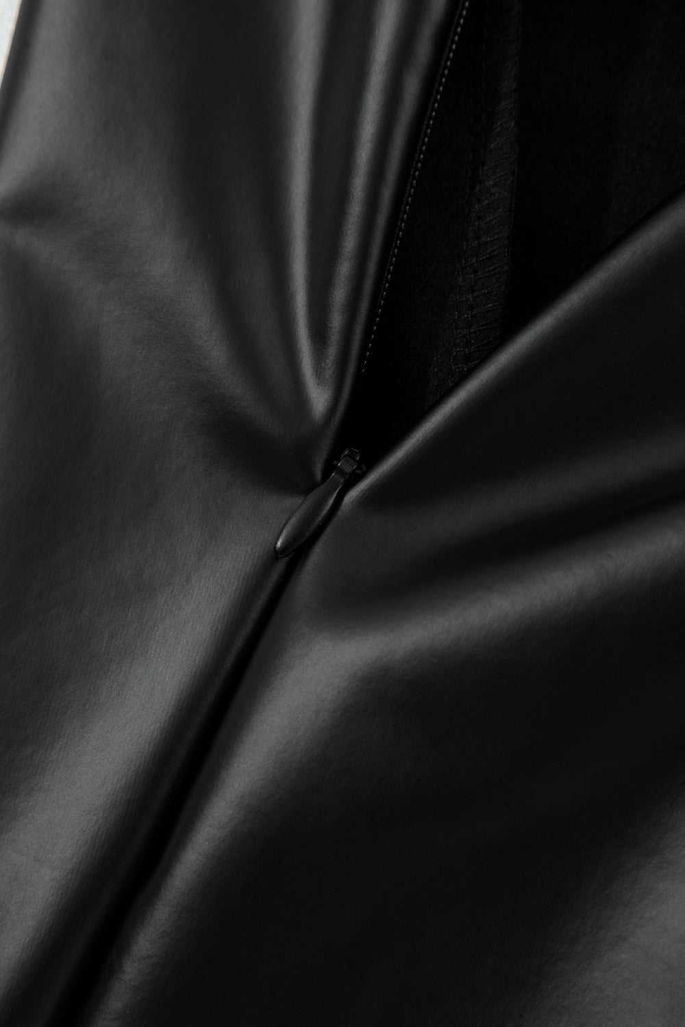 Close-up of hidden side zipper on Black Vegan Leather Leggings – High‑Rise Skinny Fit for secure and seamless wear.
