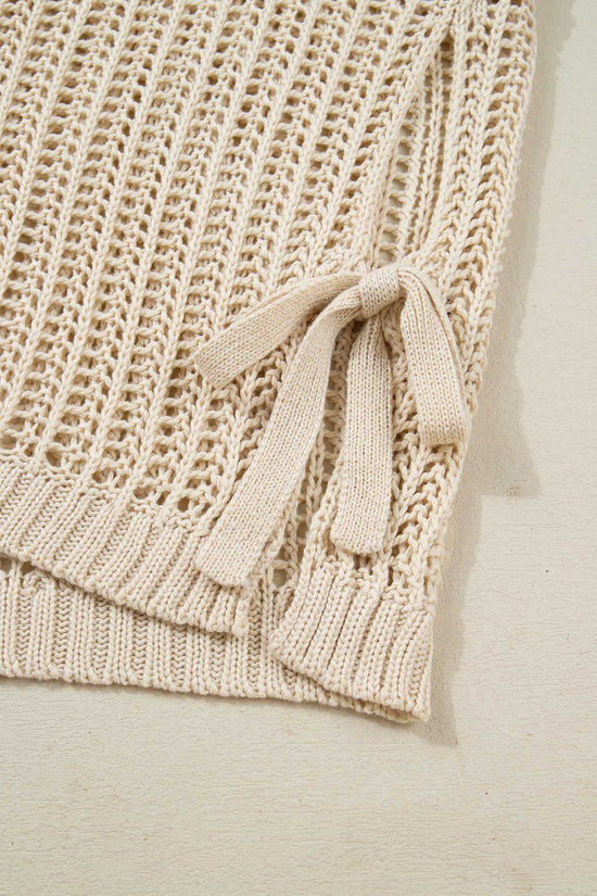 Close-up of beige Plus Size Bow Tie Open‑Knit Jumper for Women showing side bow detail and soft open-knit texture.