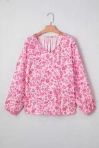 Model wearing Pink Floral Lightweight Blouse with jeans, styled for a chic and casual spring outfit.