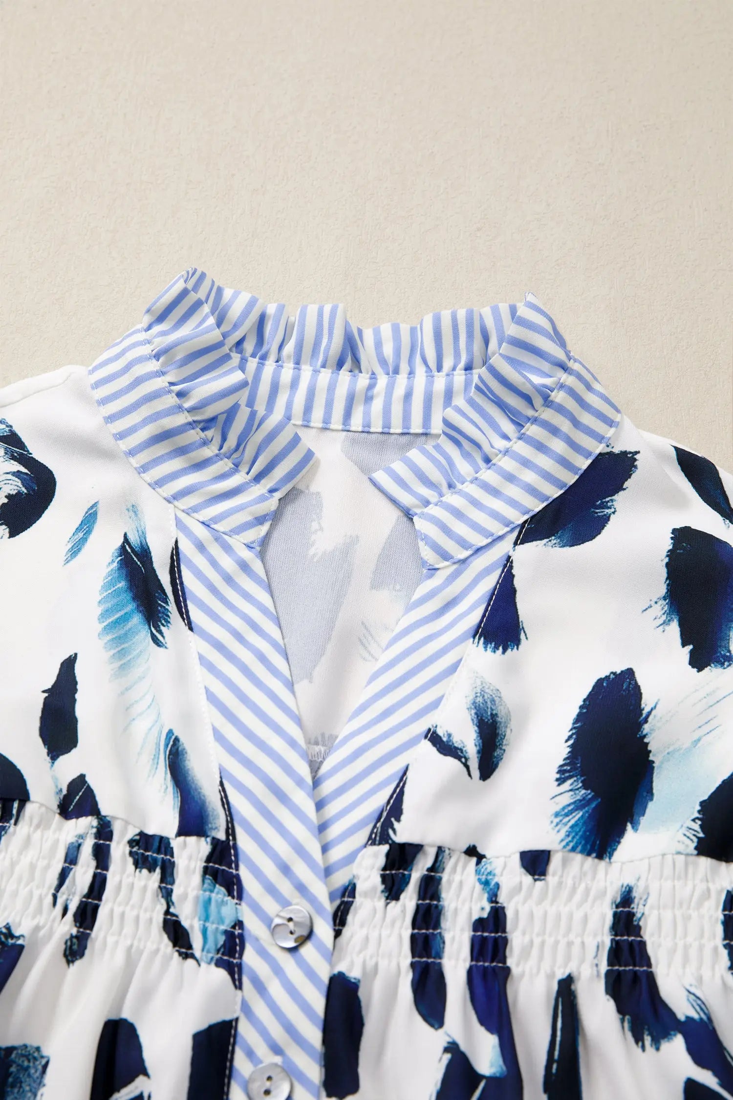 Beige abstract animal print striped ruffle trim v neck blouse
