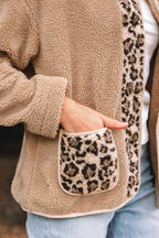 Detail of leopard print patch pocket on women’s plush fleece jacket, highlighting texture and contrast trim for stylish outerwear.