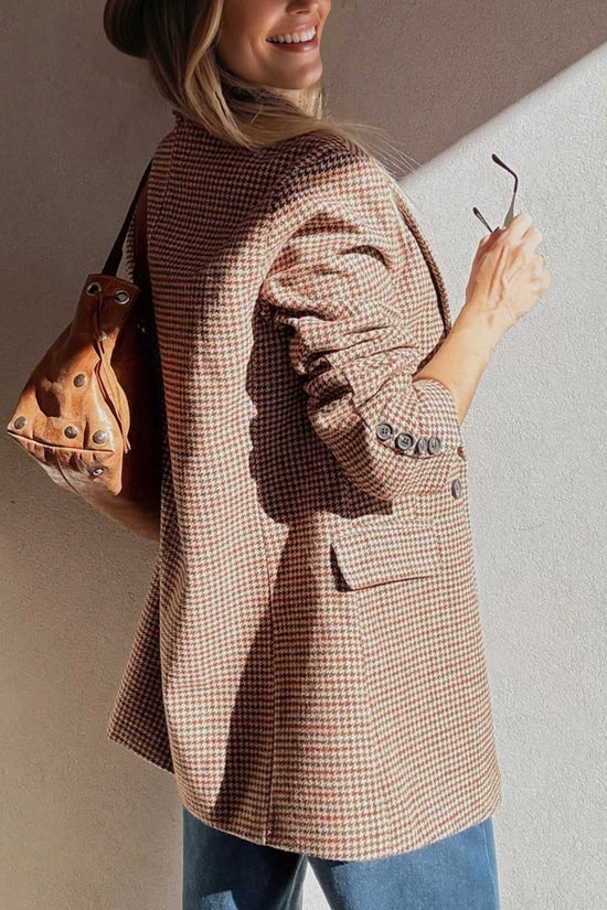 Back view of Ladies Brown Houndstooth Fitted Blazer paired with a brown leather bag, highlighting tailored fit and button details.