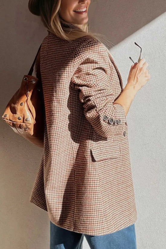 Back view of Ladies Brown Houndstooth Fitted Blazer paired with a brown leather bag, highlighting tailored fit and button details.