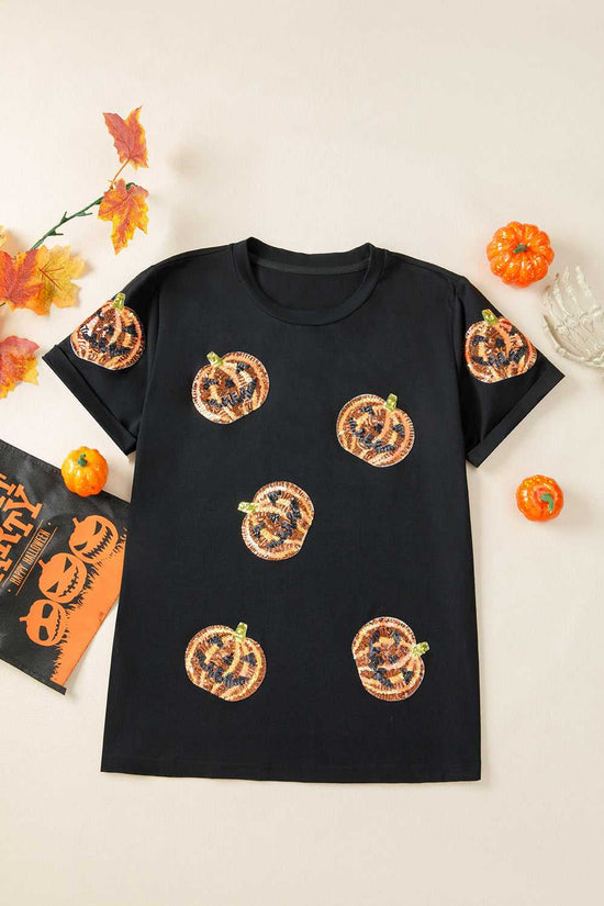 Sequin Pumpkin Face Halloween T-Shirt on a white background with decorative elements.