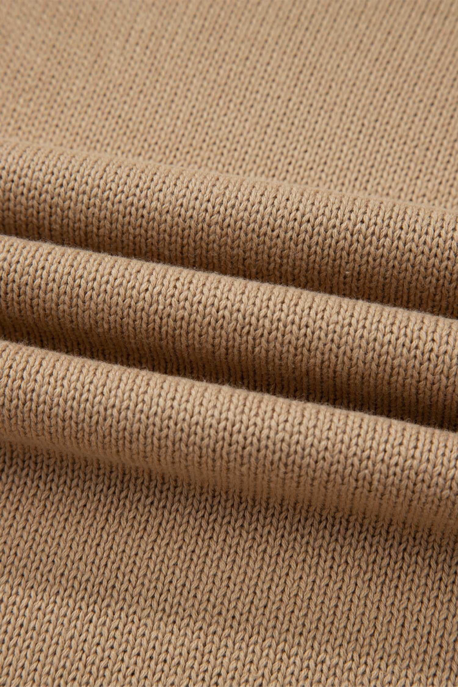 Close-up of beige fabric with a textured pattern