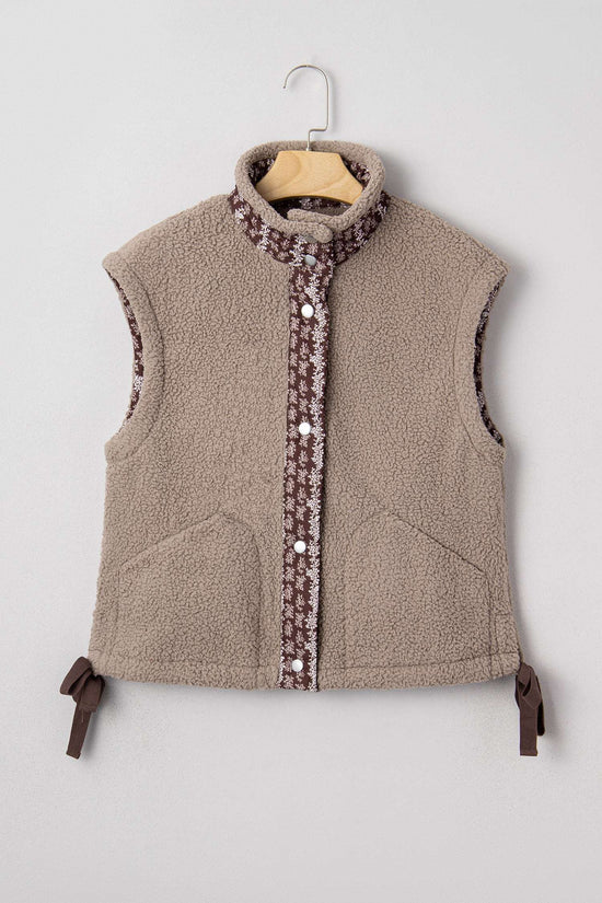 Flat lay of Women's Country Borg Fleece Gilet Winter Vest FashionFitz on hanger, featuring khaki sherpa fleece and floral button placket.