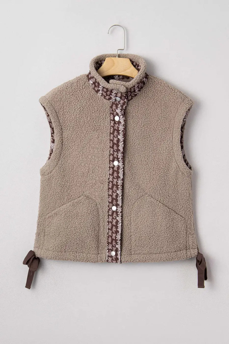 Flat lay of Women's Country Borg Fleece Gilet Winter Vest FashionFitz on hanger showing full front with floral trim and snap closure.