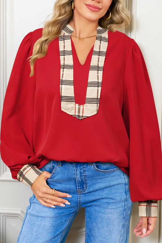 Red Tartan Fusion V‑Neck Blouse styled with blue jeans, showcasing plaid neckline and cuff details for a chic spring look.