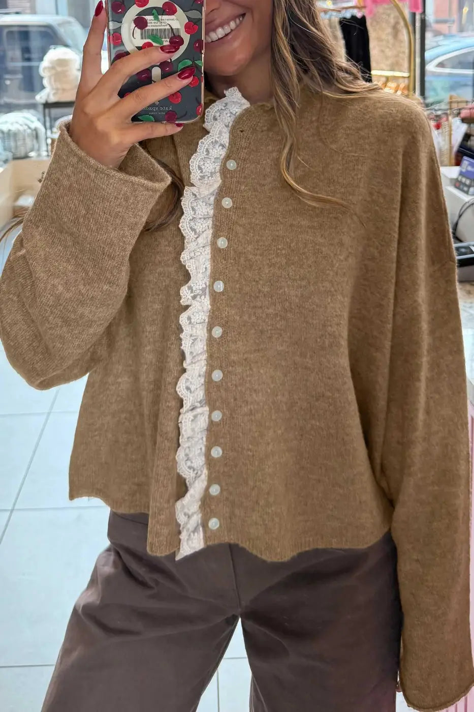 Taupe Lace Trim Loose Cardigan with white lace detail and front button closure, styled for casual daily wear. Feminine knitwear for fall layering.