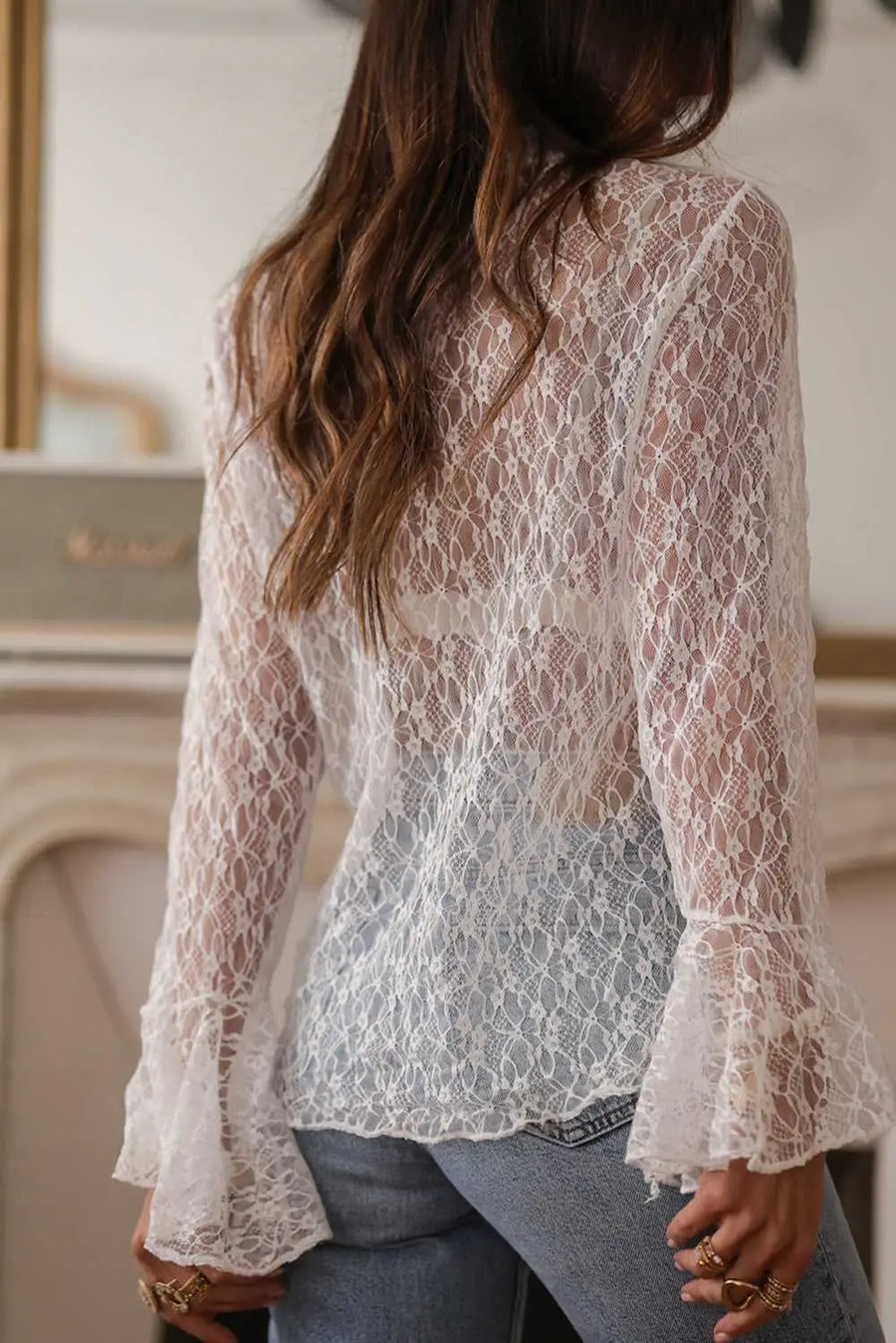 Side view of White Sheer Lace Bell Sleeve Mock Neck Blouse showing bell sleeve flare and elegant mock neck — Fashionfitz