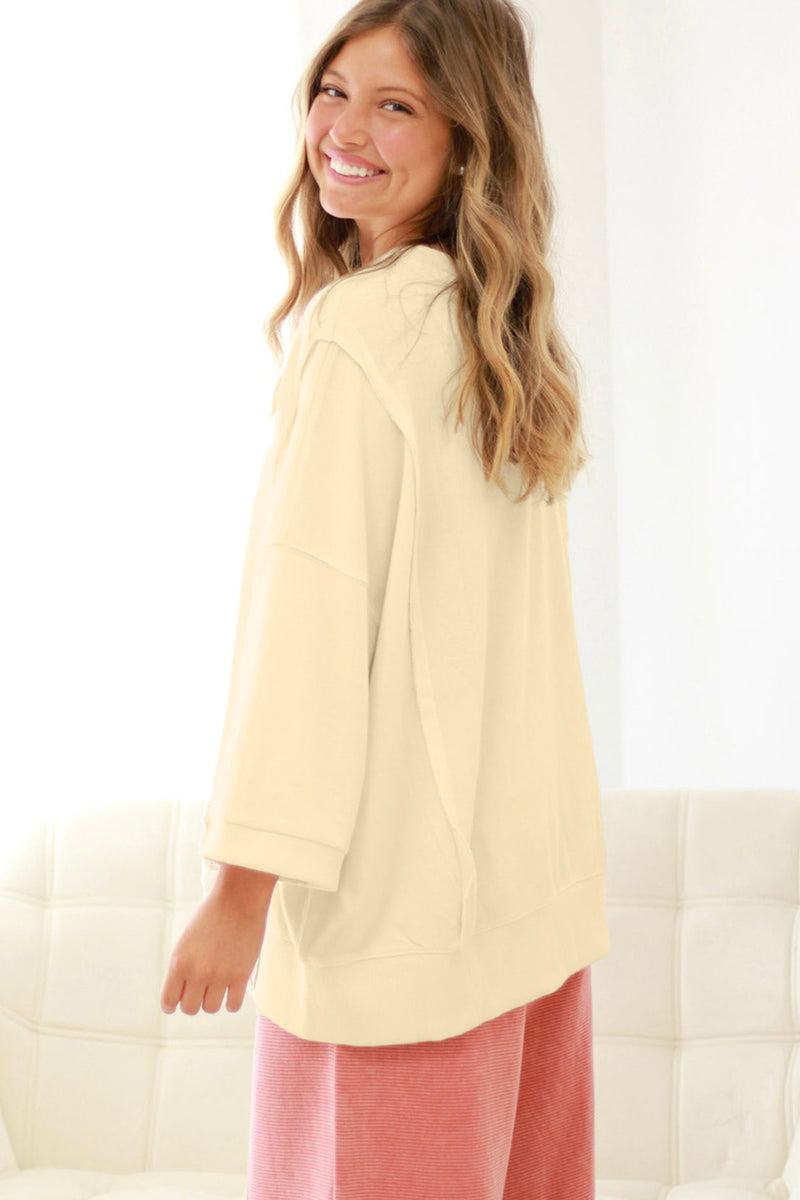 Back view of raw seam floral bow baggy plus size pullover