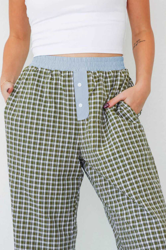 Close-up of Ladies Brown Gingham Boxer Trousers by FashionFitz highlighting the blue waistband, button fly, and soft gingham fabric for daily wear.