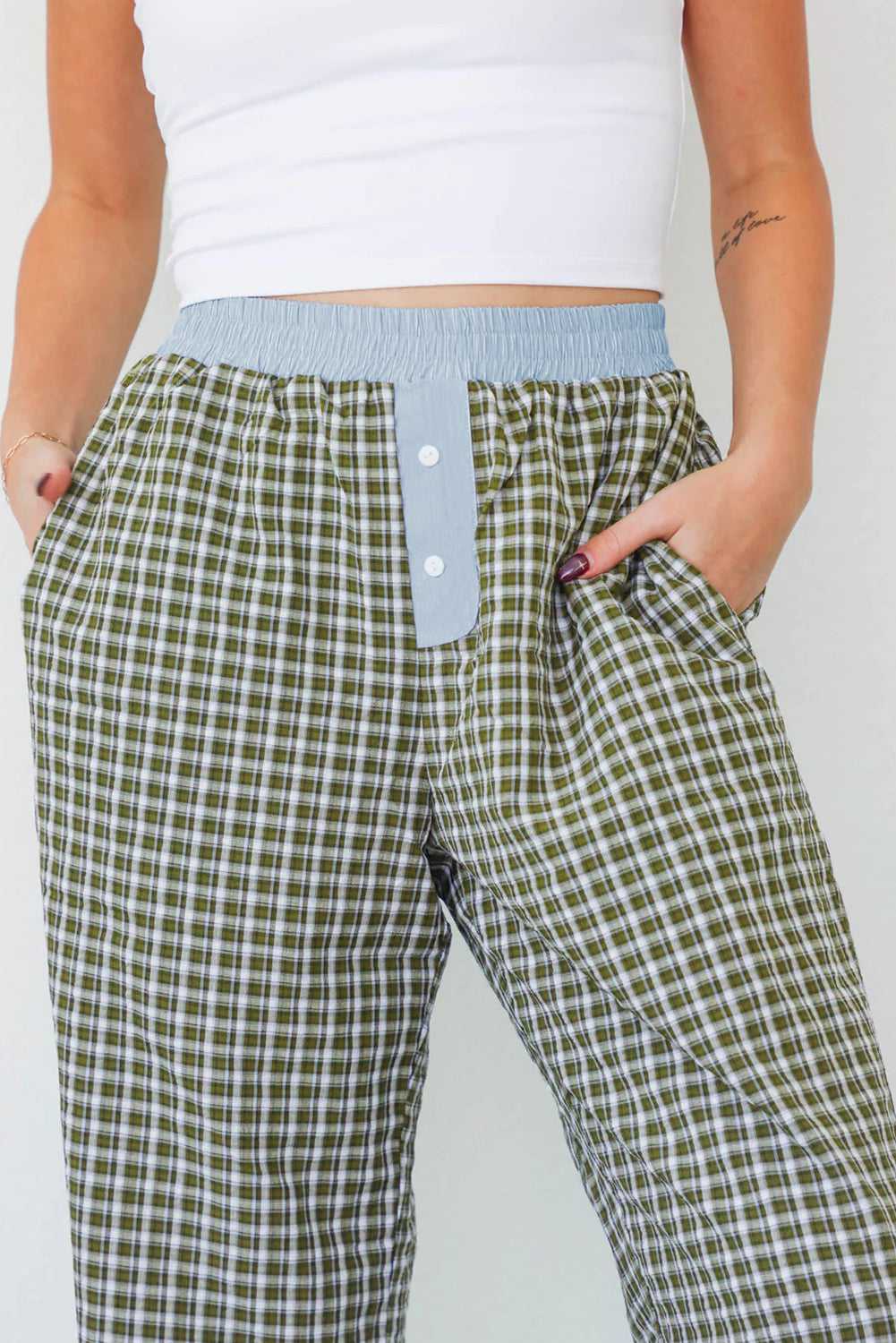 Close-up of Ladies Brown Gingham Boxer Trousers by FashionFitz highlighting the blue waistband, button fly, and soft gingham fabric for daily wear.
