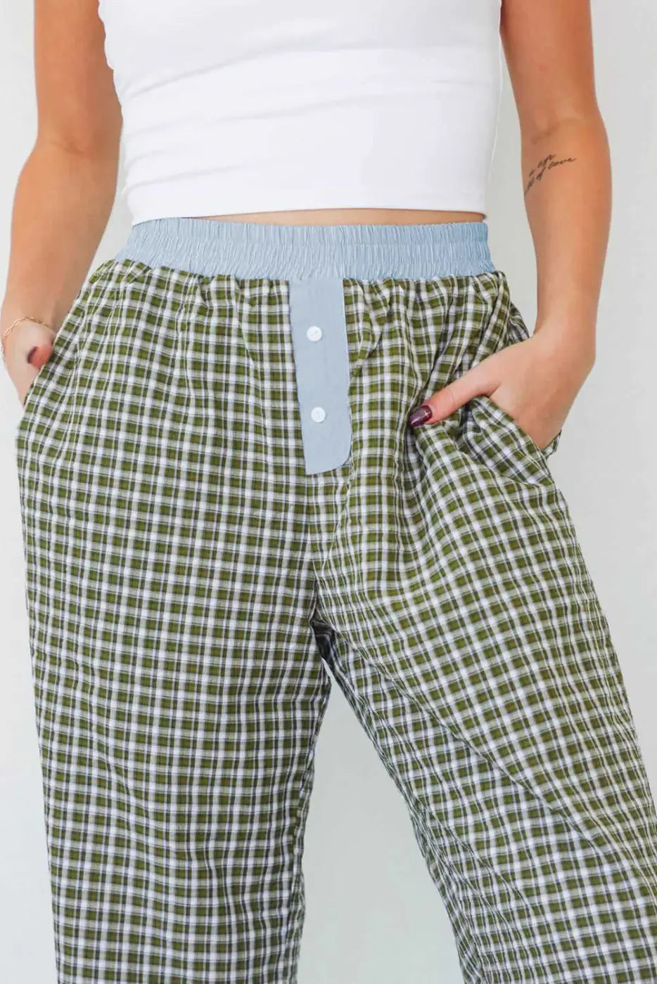 Close-up of Ladies Brown Gingham Boxer Trousers by FashionFitz highlighting the blue waistband, button fly, and soft gingham fabric for daily wear.