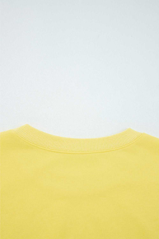 Rear neckline detail of yellow Drop Crop Wide-Leg Pants Set, showcasing ribbed collar for added comfort and durability.