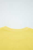 Rear neckline detail of yellow Drop Crop Wide-Leg Pants Set, showcasing ribbed collar for added comfort and durability.