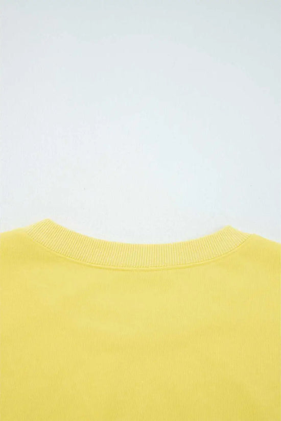 Rear neckline detail of yellow Drop Crop Wide-Leg Pants Set, showcasing ribbed collar for added comfort and durability.