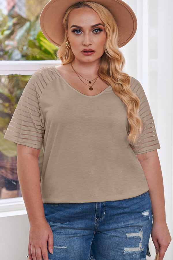 Woman wearing striped raglan sleeve plus size tee