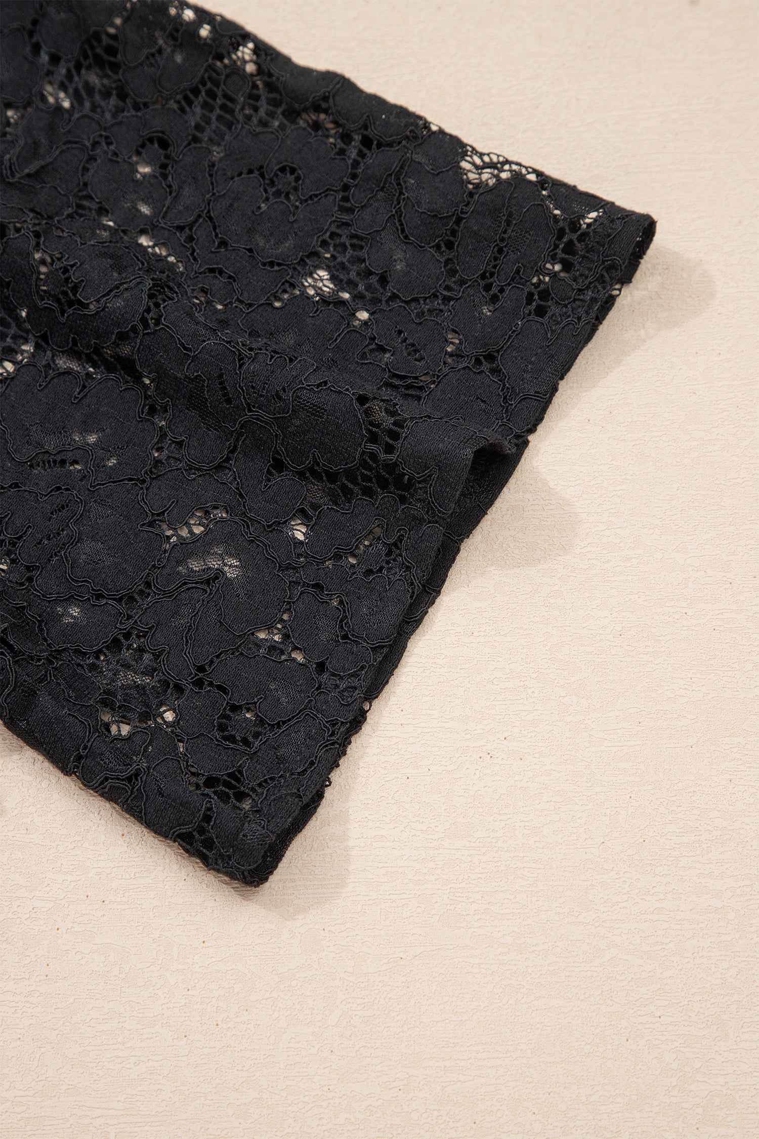 Sleeve detail of Black Lace Maxi Dress with intricate floral lace pattern, perfect for vacation and warm-weather occasions.
