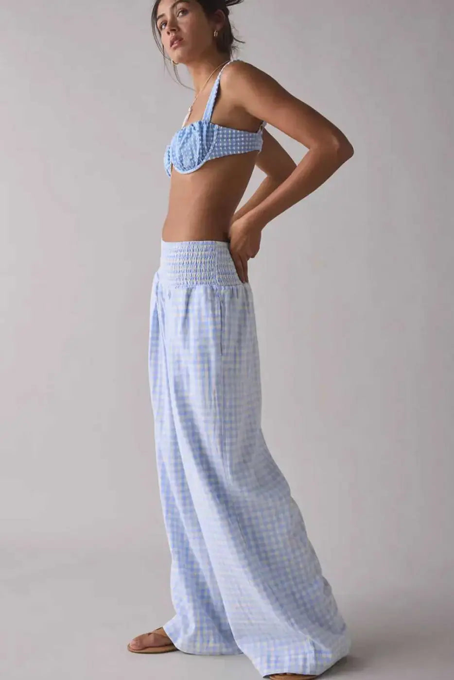 Wide leg plaid trousers styled with bustier bra