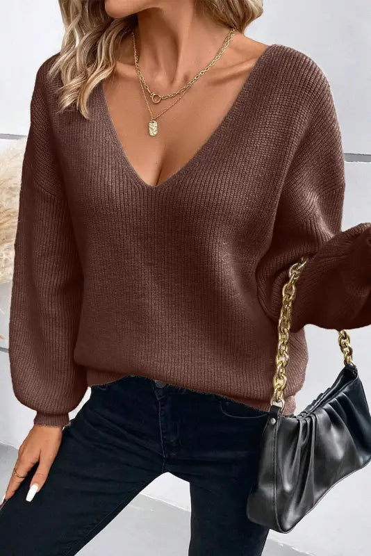 Elegant noir lantern-sleeve sweater | chic v-neck design