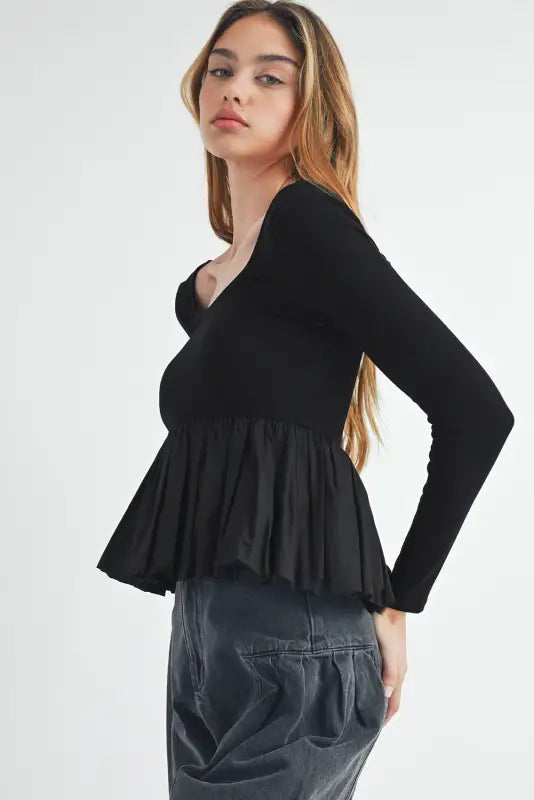 Elegant noir peplum top