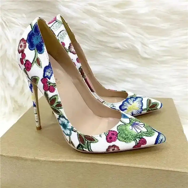 FashionFitz Embroidery Graffiti Party Heels displayed on a box. Chic floral embroidered court shoes with pointed toes and slim high heels.