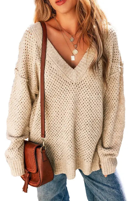 Eyelet elegance drop sweater: relax in a cream knit with a deep v-neck and open-weave pattern